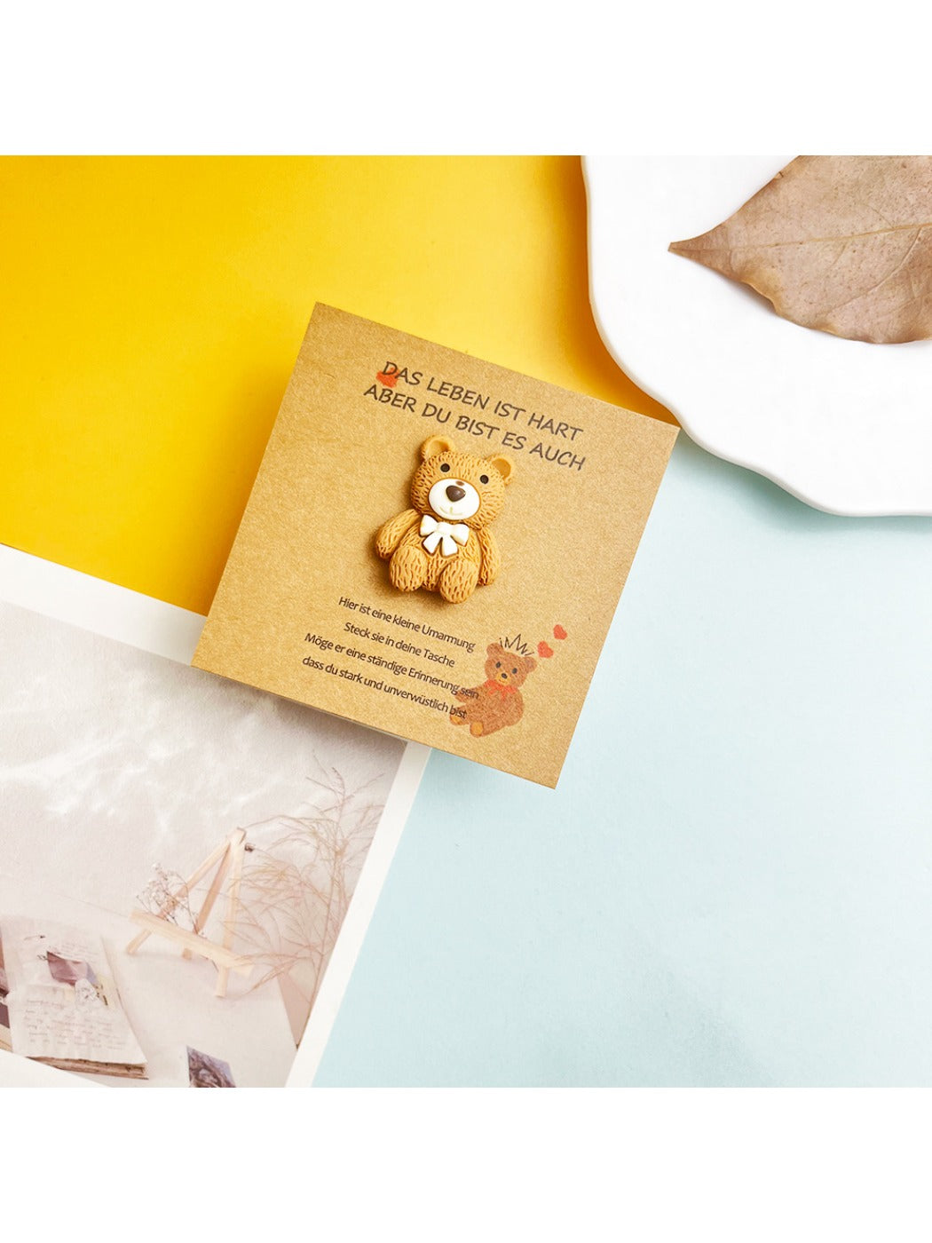 Flat lay of Taphug DIY cute bear pocket hug card with crafting materials around