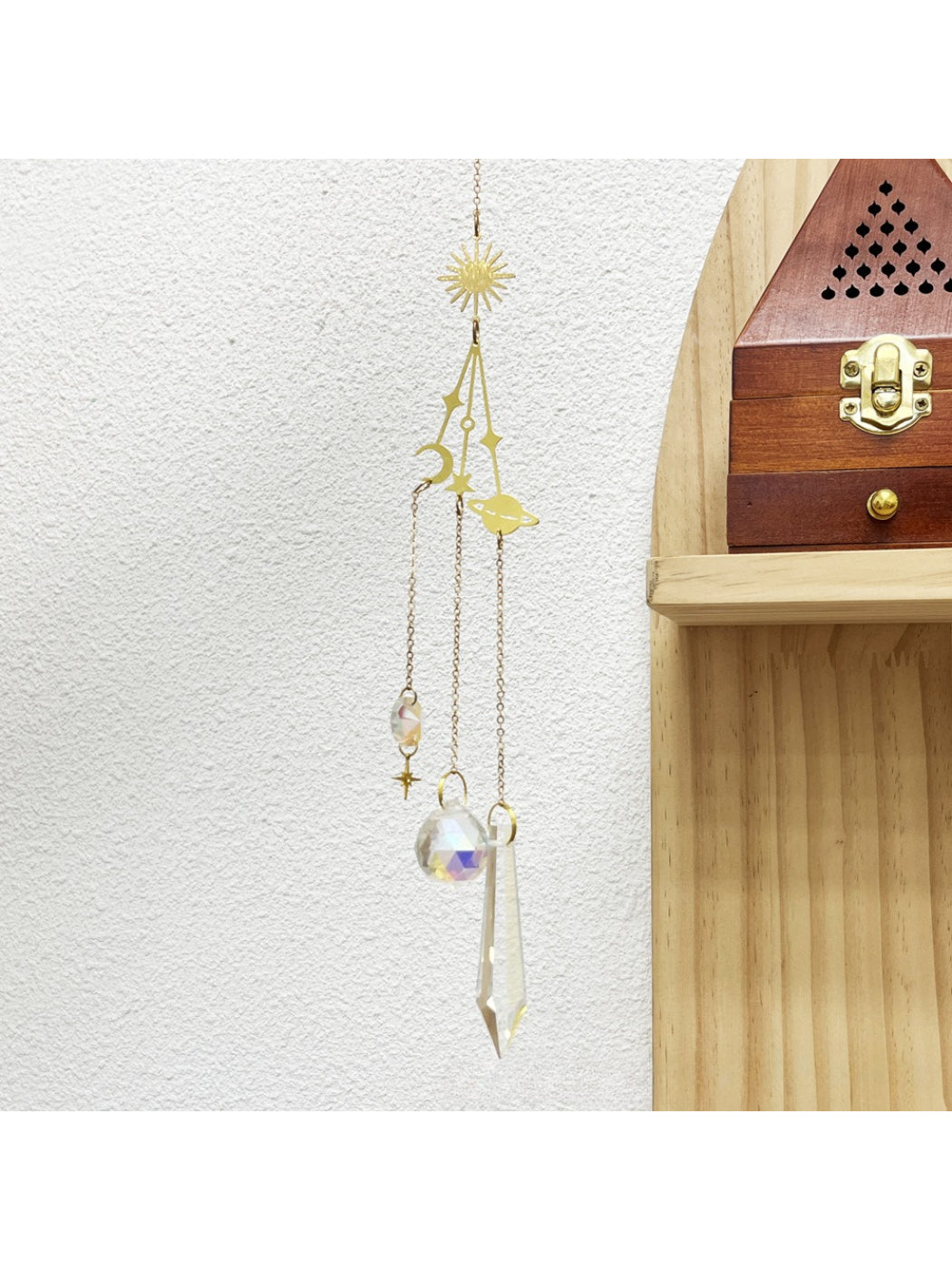 Somnia Star Moon Rainbow Sun Catcher featuring star, moon, and sun shapes with rainbow hues