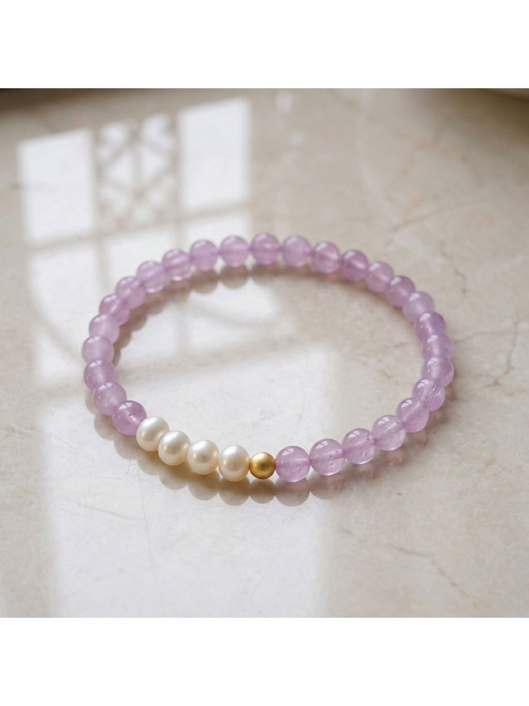 Side view of Emora bracelet showing detailed purple crystal beads and clasp
