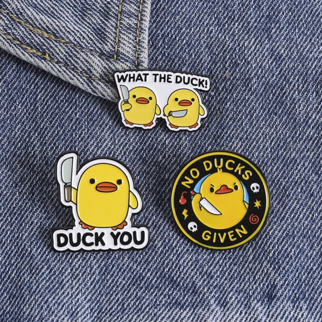 Pinori duck enamel pin packaged in a clear plastic bag with branding