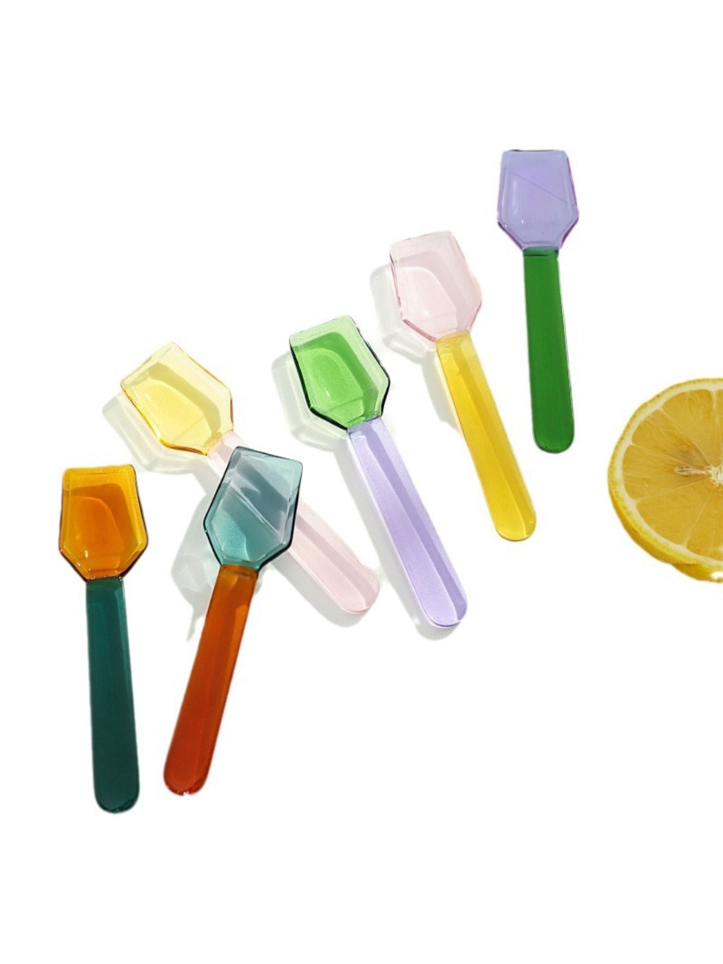 Thimara colorful glass spoon displayed with a milk dessert to emphasize design use