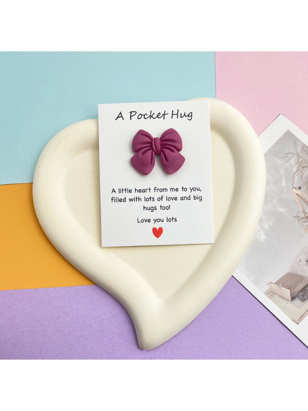 Taphug Pocket Hug greeting card with bow in natural lighting