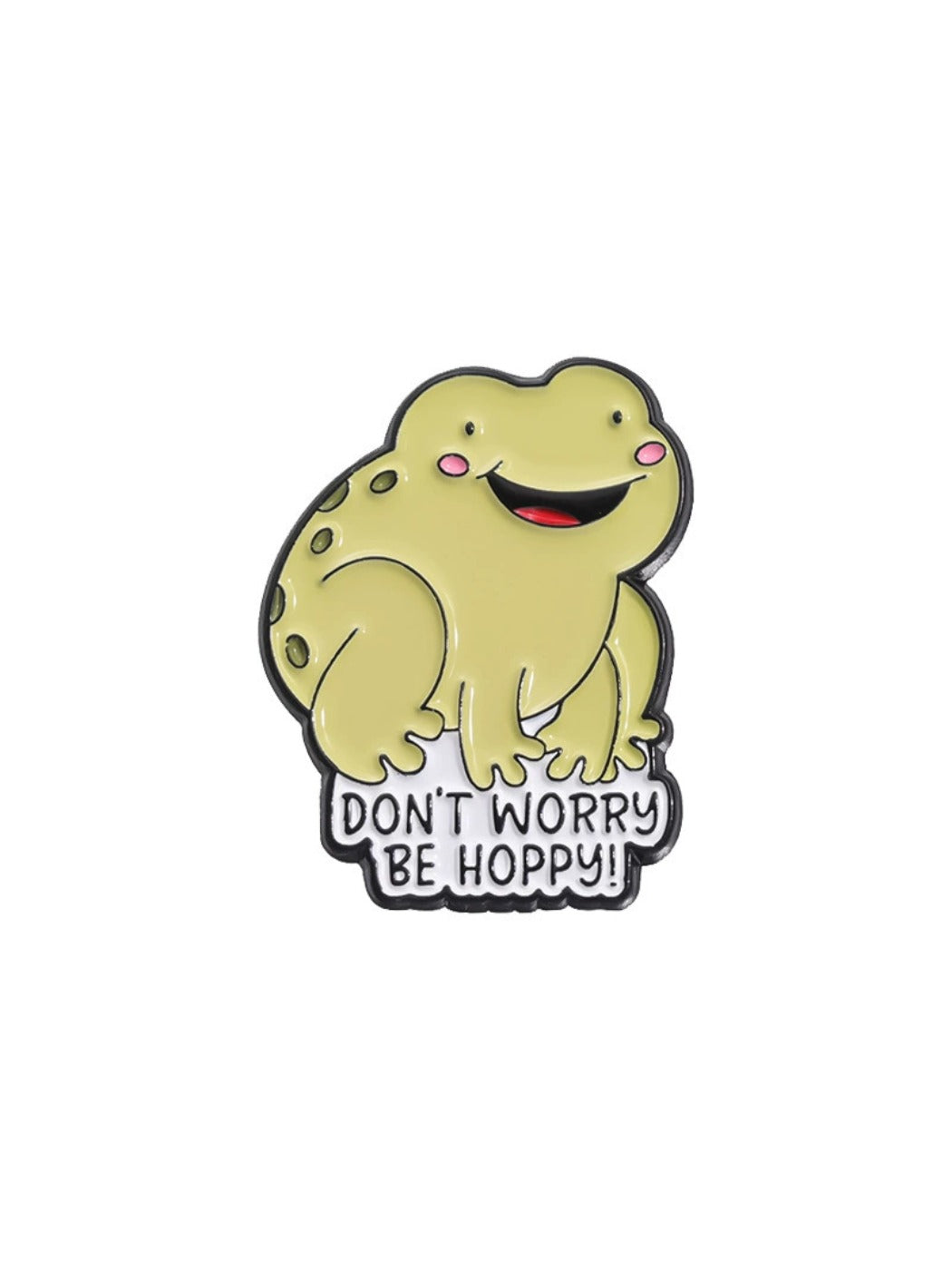 Pinori frog badge pin photographed with soft shadows on a white surface