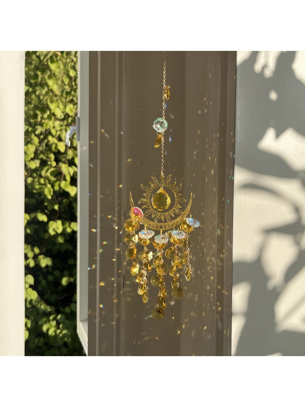 Somnira dream catcher displayed against a wooden background showing full design