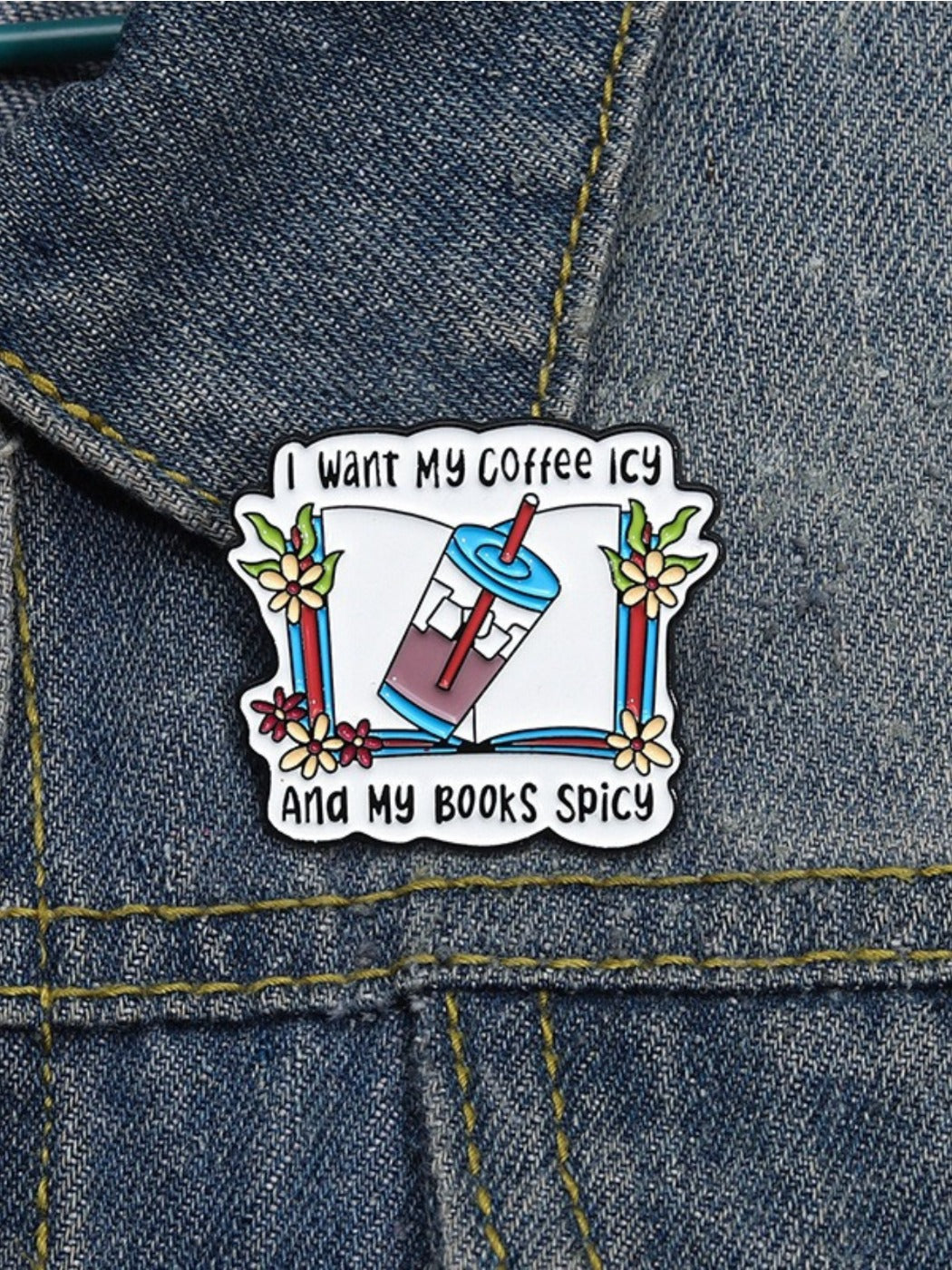 Pinori vintage book pin displayed on a denim jacket pocket