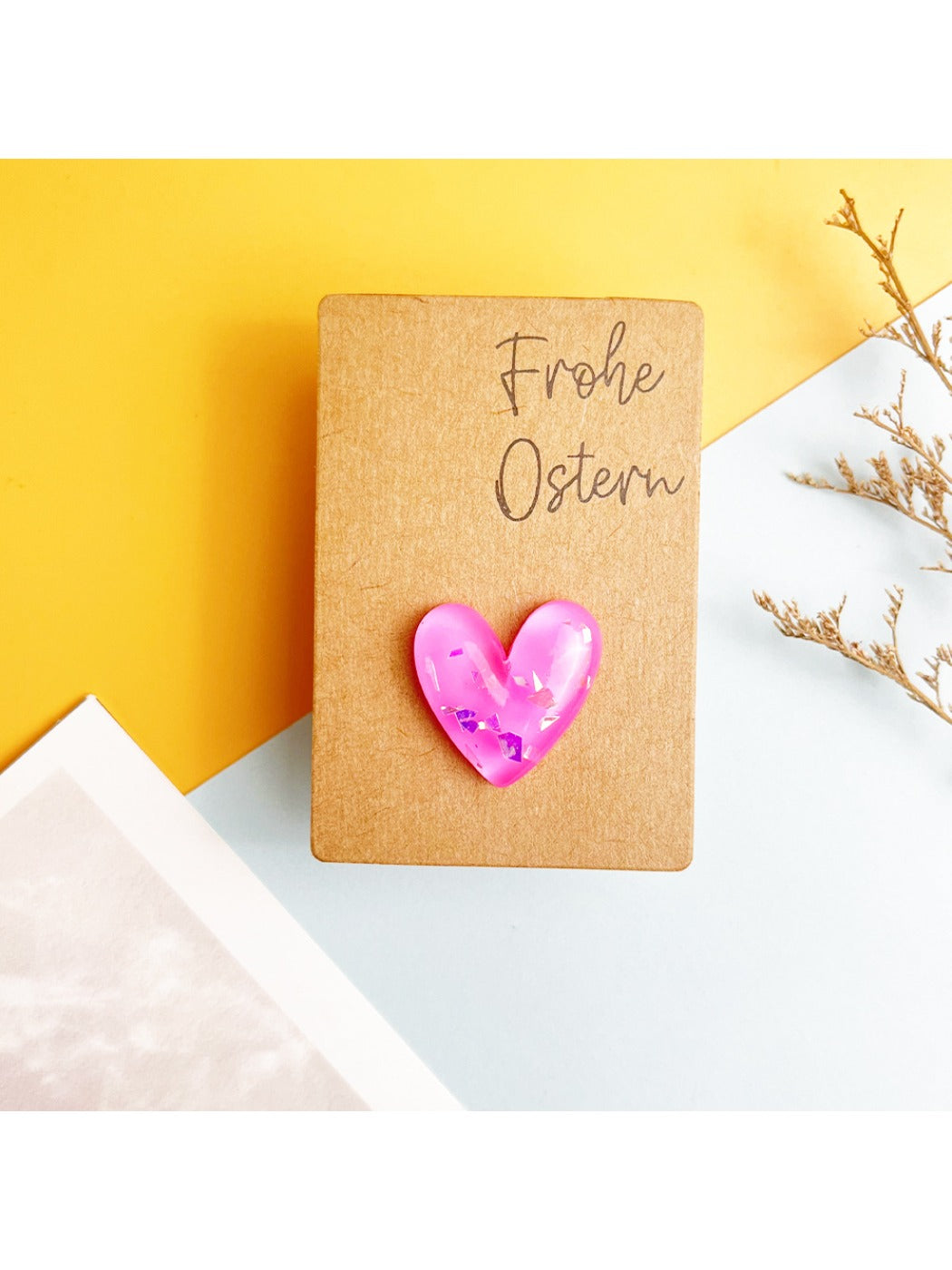 Decorative dried flowers embedded inside a finished resin heart pocket hug