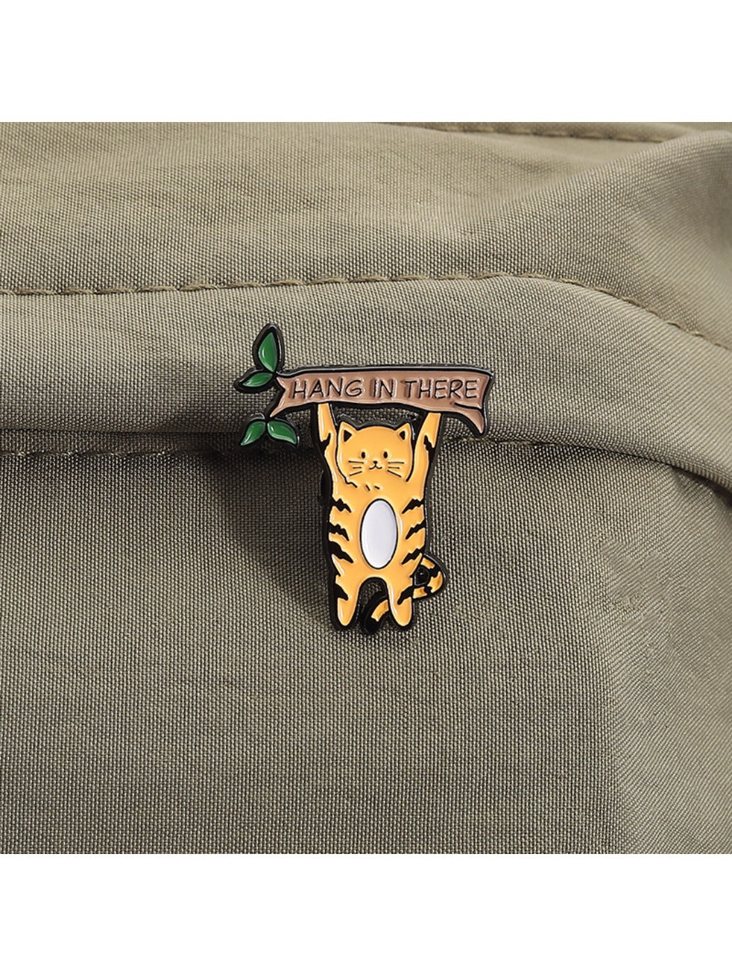 Side angle of Pinori minimalist cat brooch highlighting thickness and pin clasp