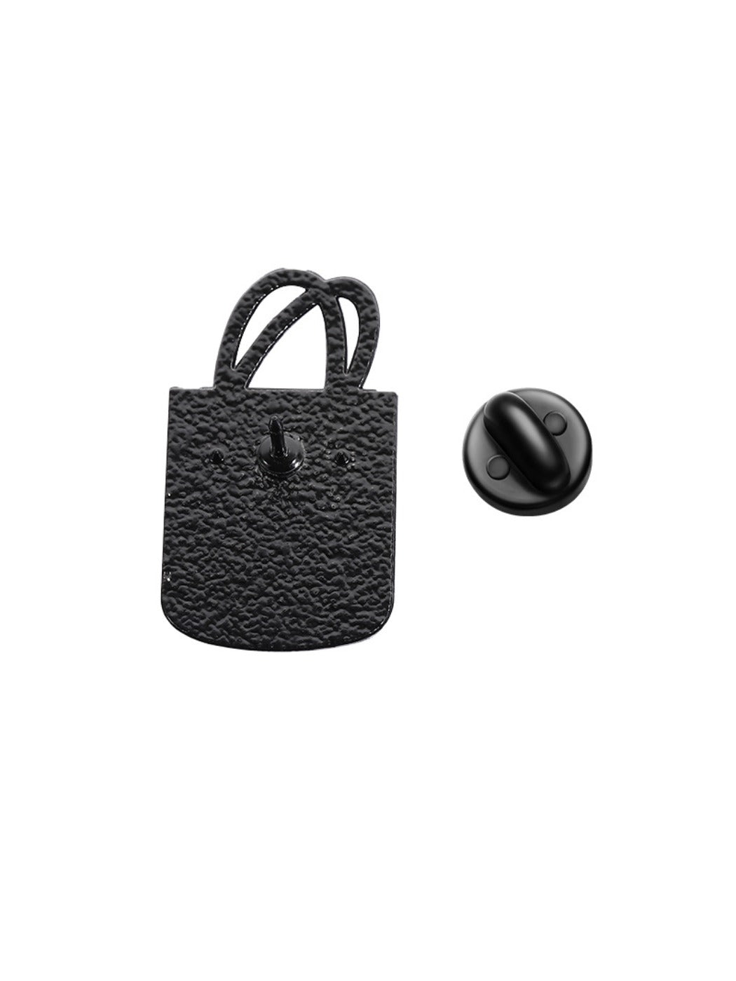 Pinori pink tote bag brooch next to a ruler showing its compact size