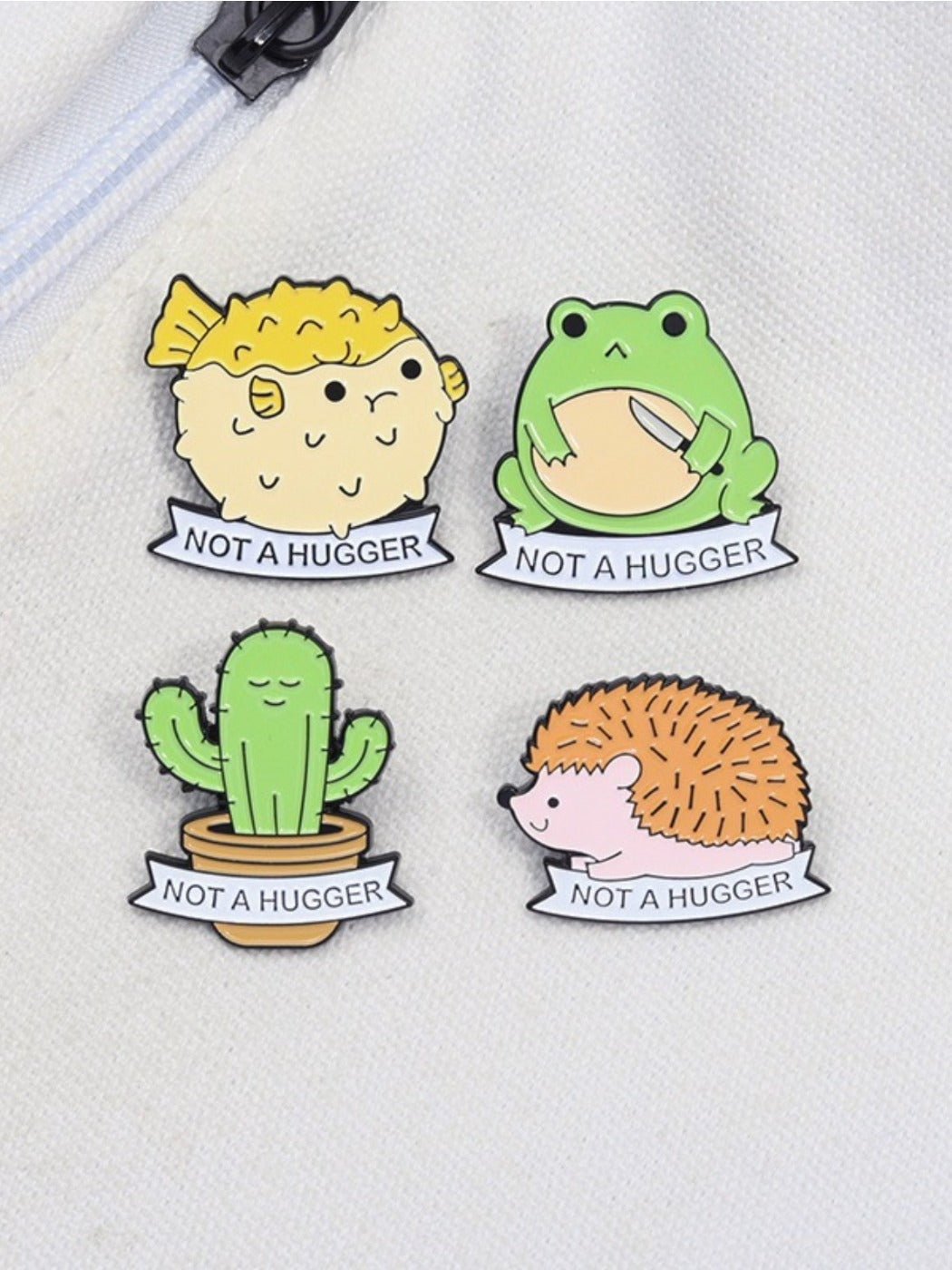 Side view of frog and cactus enamel pin showing detailed enamel colors