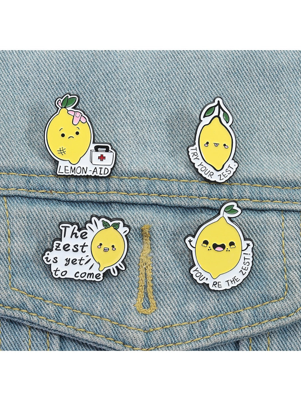 Pinori lemon brooch displayed on fabric to show size and color contrast