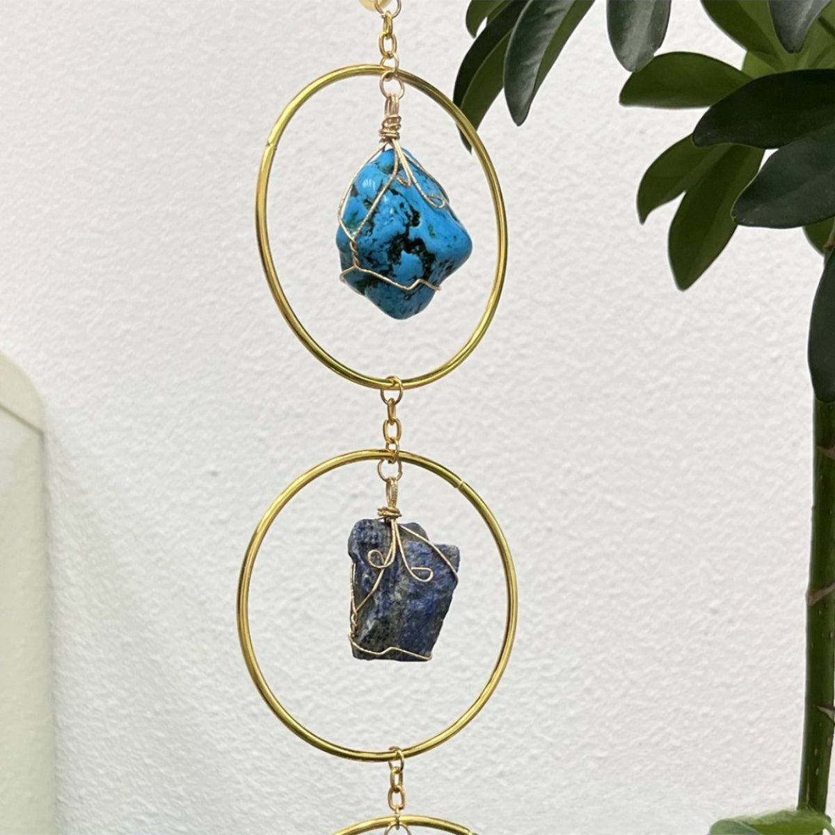 Close-up of Somnira colorful stone ring hanging decor showing multicolor drop details