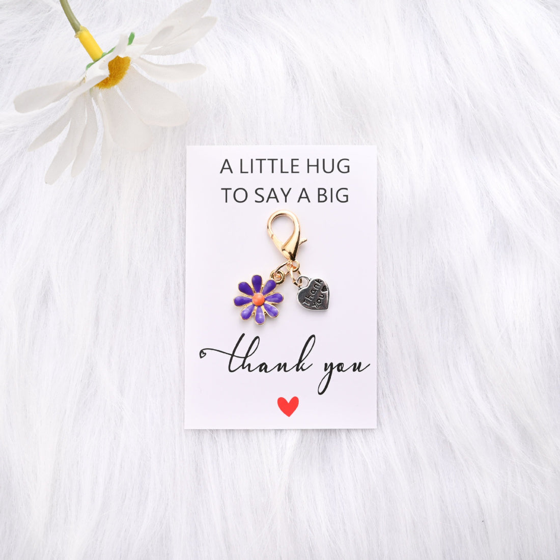 Taphug Daisy Heart Thank You Pocket Hug card displayed on wooden surface
