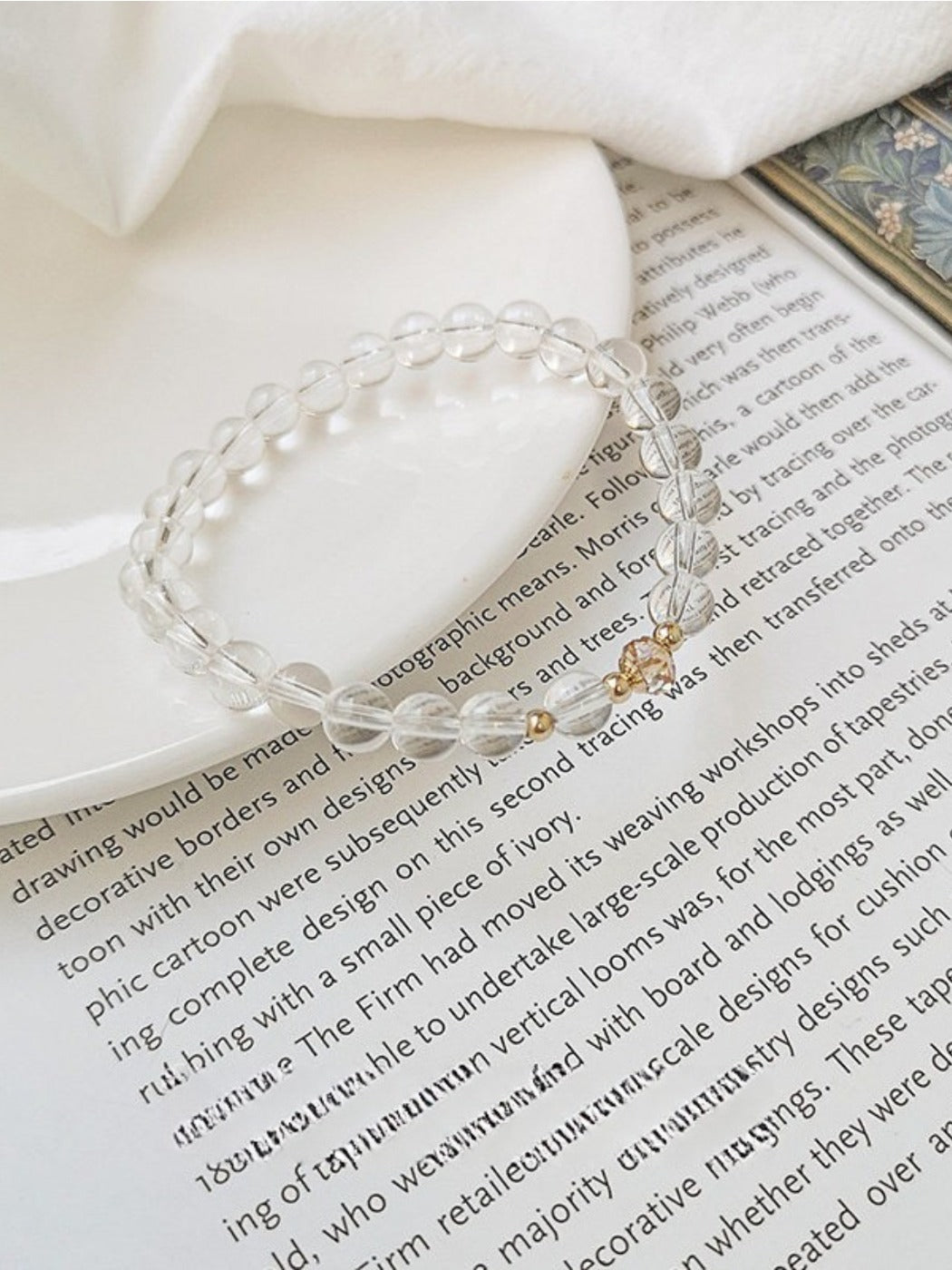 Emora bracelet featuring clear white crystals and silver links shown on a wrist