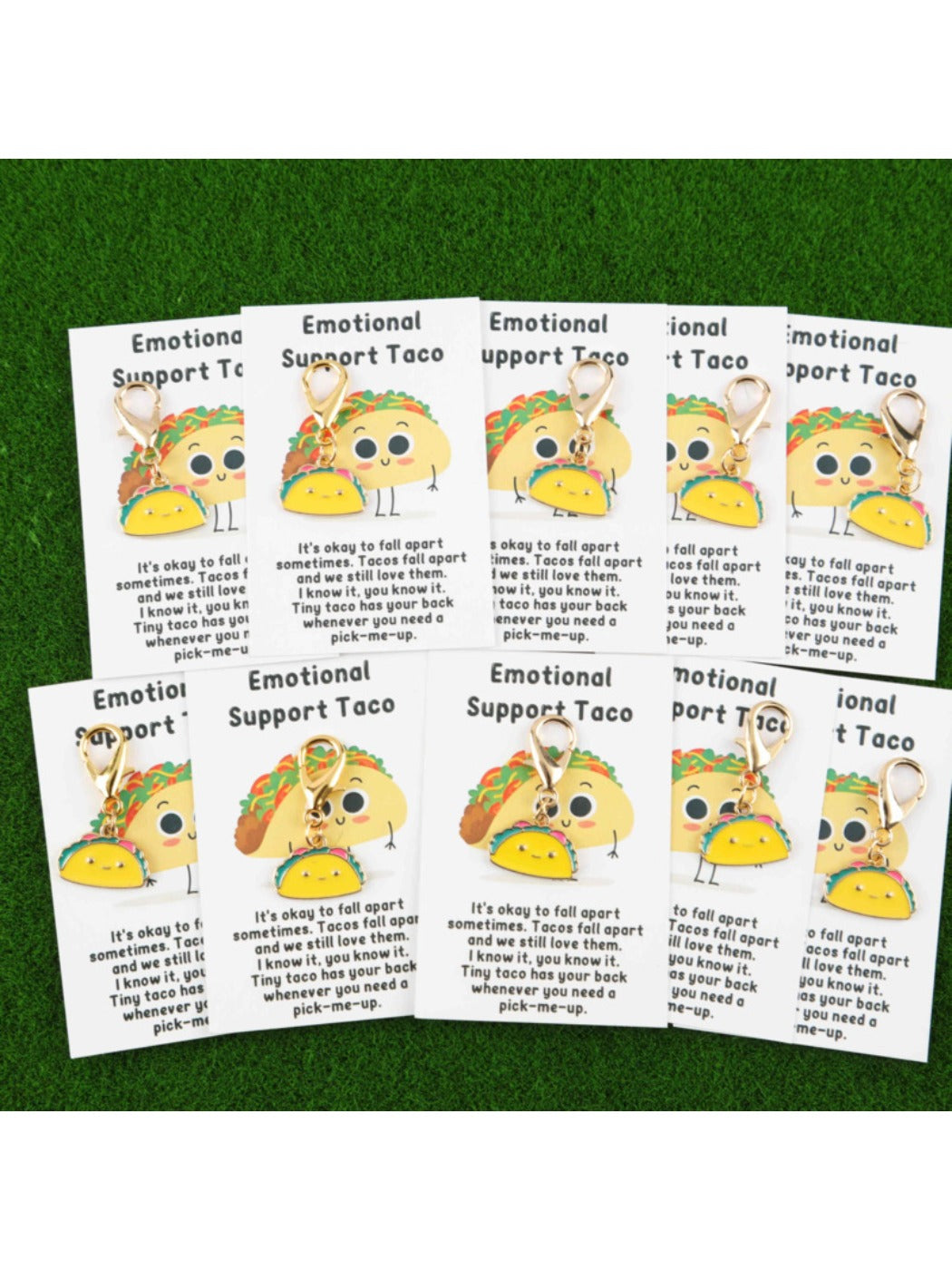 Taco keychains displayed alongside colorful greeting cards