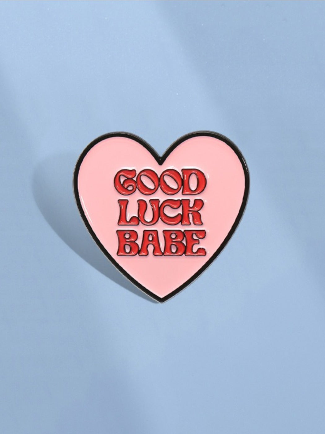 Pinori letter love heart pin displayed on fabric surface