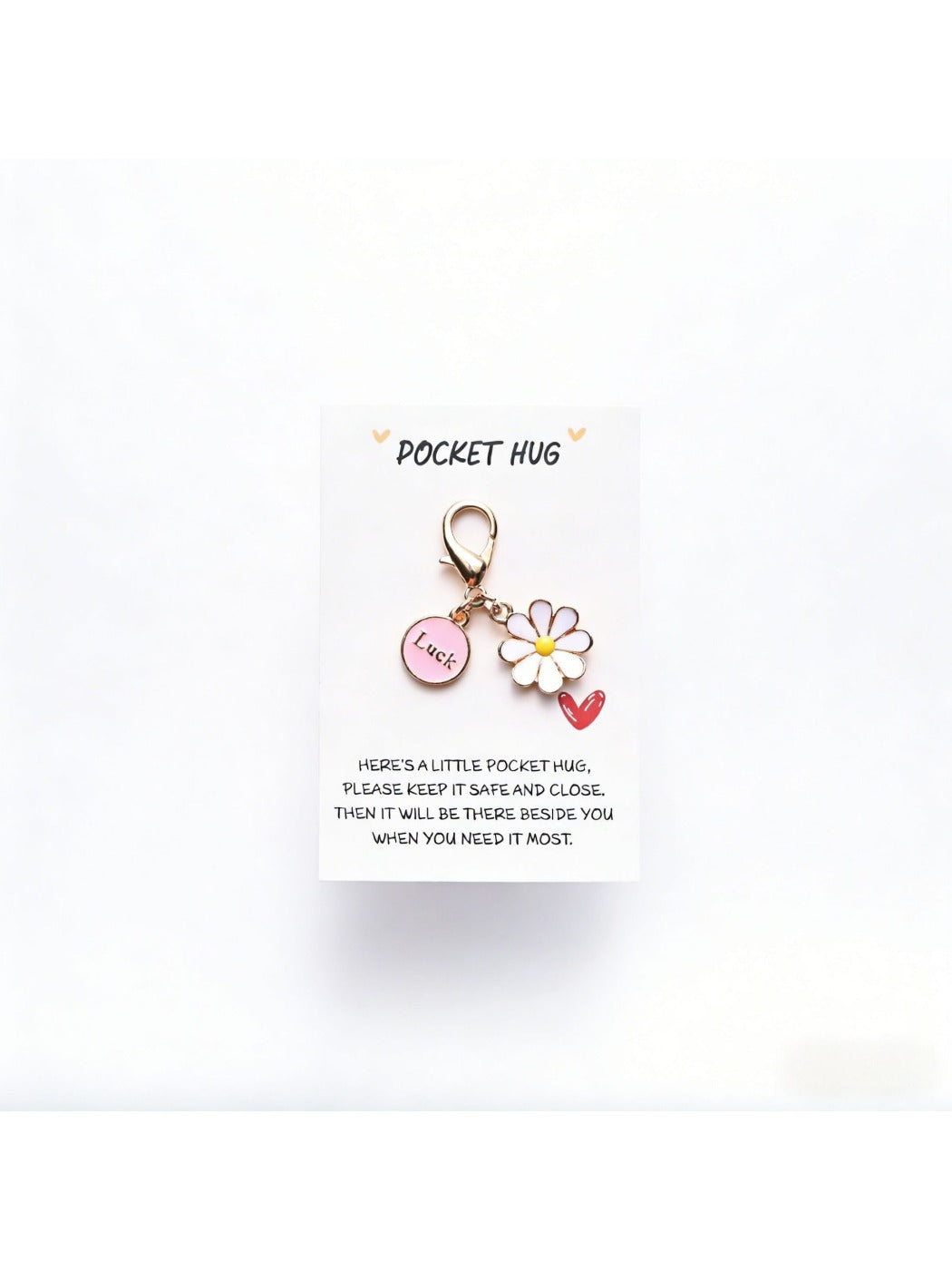 Taphug Pocket Hug Daisy Keychain with white daisy charm and gold ring on a neutral background