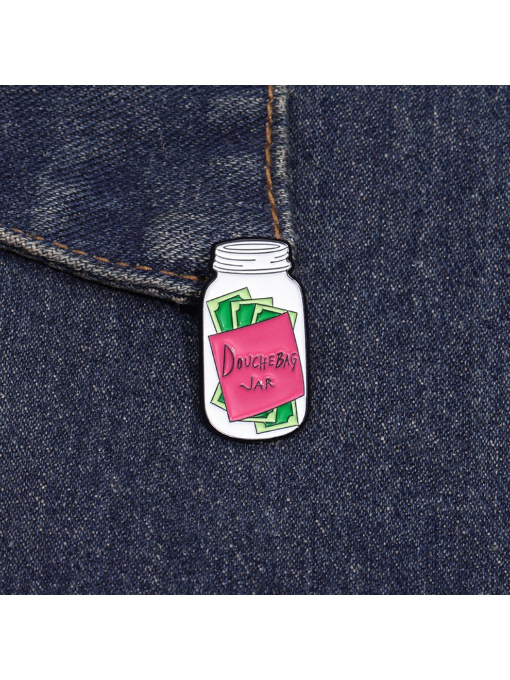 Pinori Message in a Bottle coin bank badge pin next to a coin for size comparison
