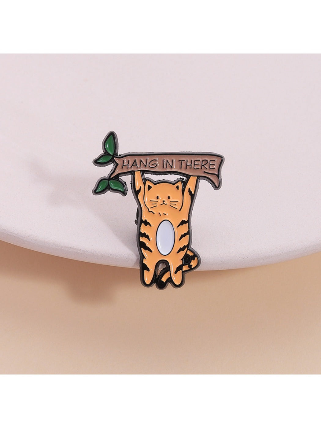 Pinori cartoon minimalist cat brooch front view with black and white enamel design