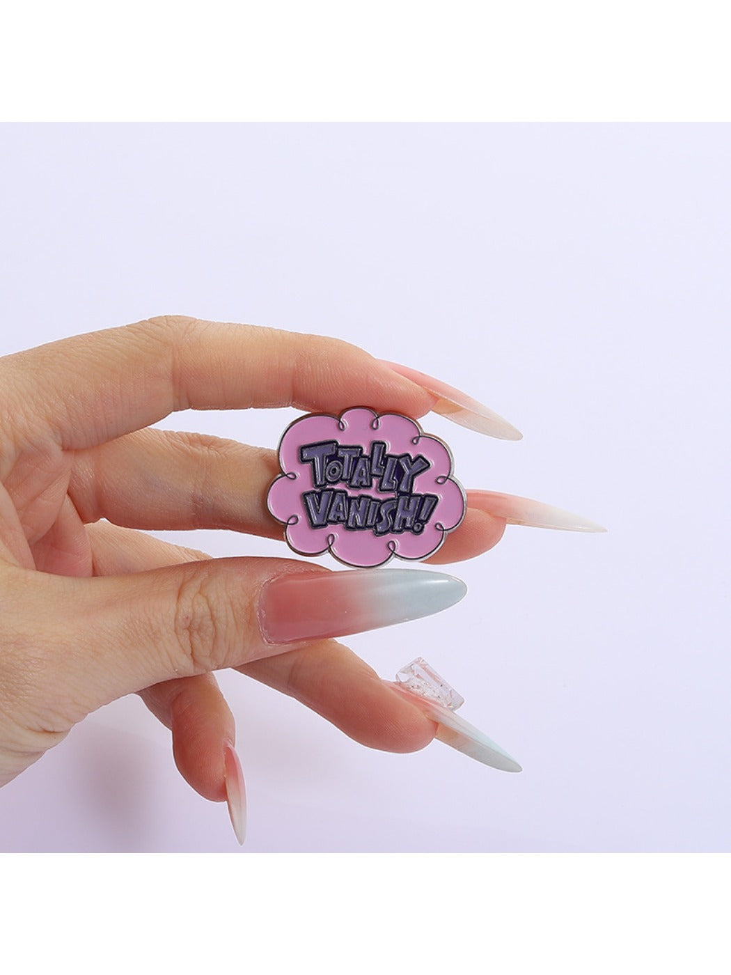 Metal pin featuring a stylized pink cloud with smooth edges