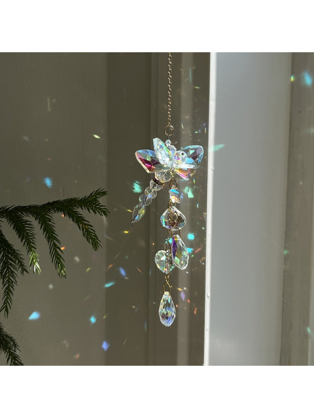 Somnira Shine Dream Catcher hanging on wall with soft natural light highlighting feathers
