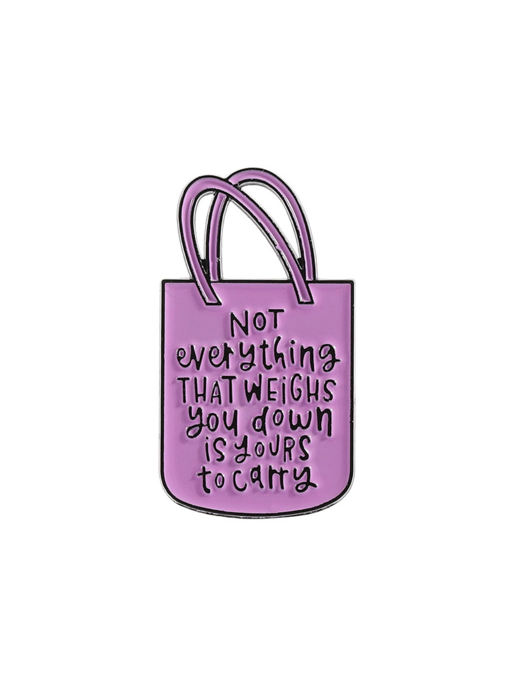 Pinori pink tote bag shaped brooch with gold chain detail placed on a wooden surface
