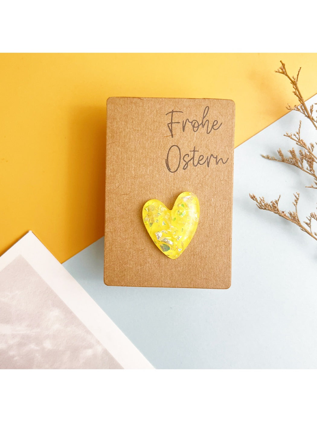 Multiple resin heart pocket hugs in various colors displayed on table