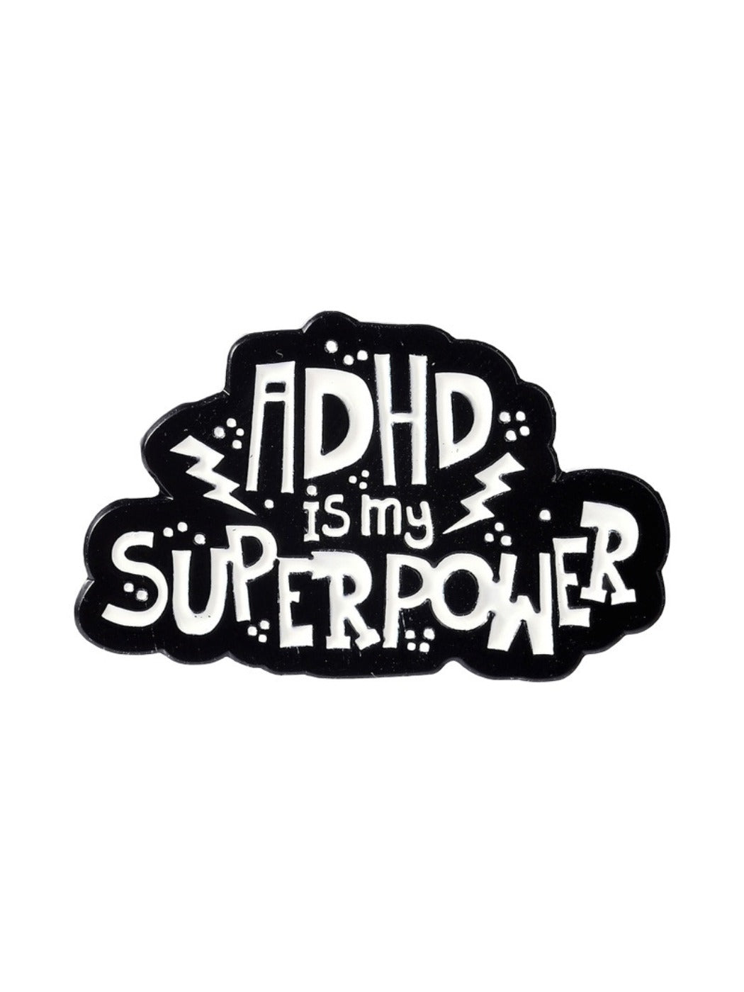 Pinori pin badge placed on a wooden surface with clear 'ADHD Is My Superpower' text