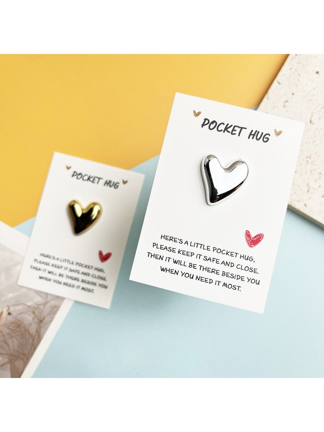 Close-up of Taphug Pocket Hug shiny heart showing detailed love message