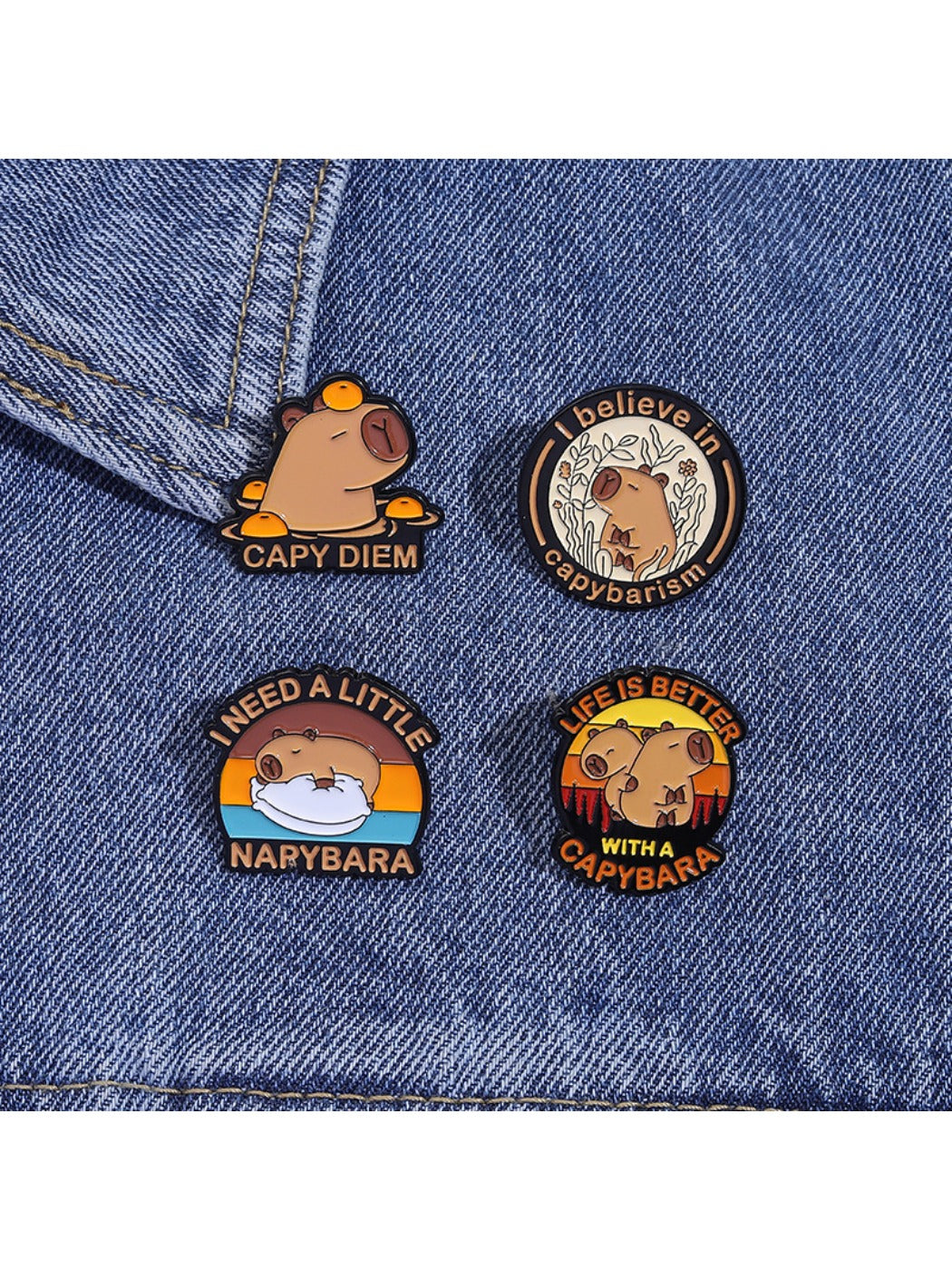 Pinori capybara enamel pin displayed on a denim jacket pocket