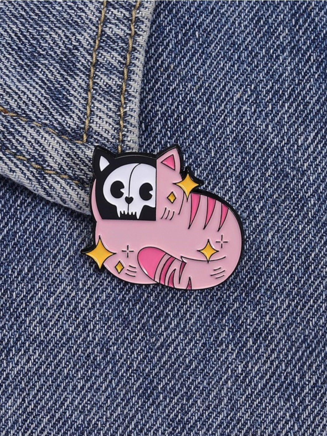 Close-up of Pinori Gothic pink cat skull brooch showing detailed design