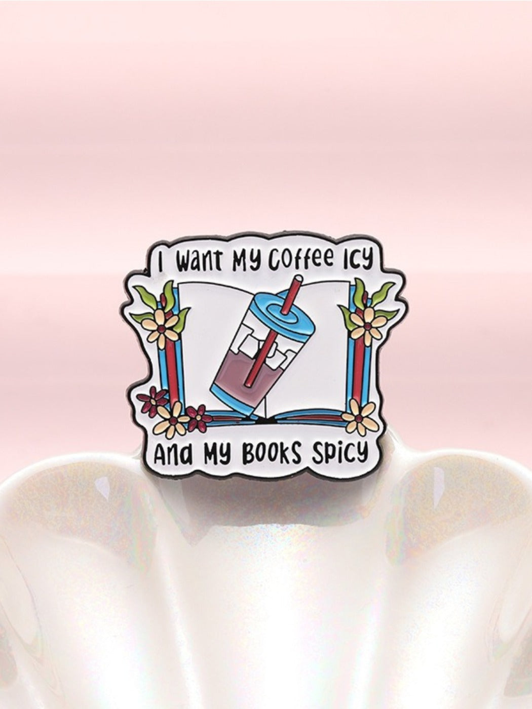 Close-up of Pinori vintage book pin showing detailed text and design