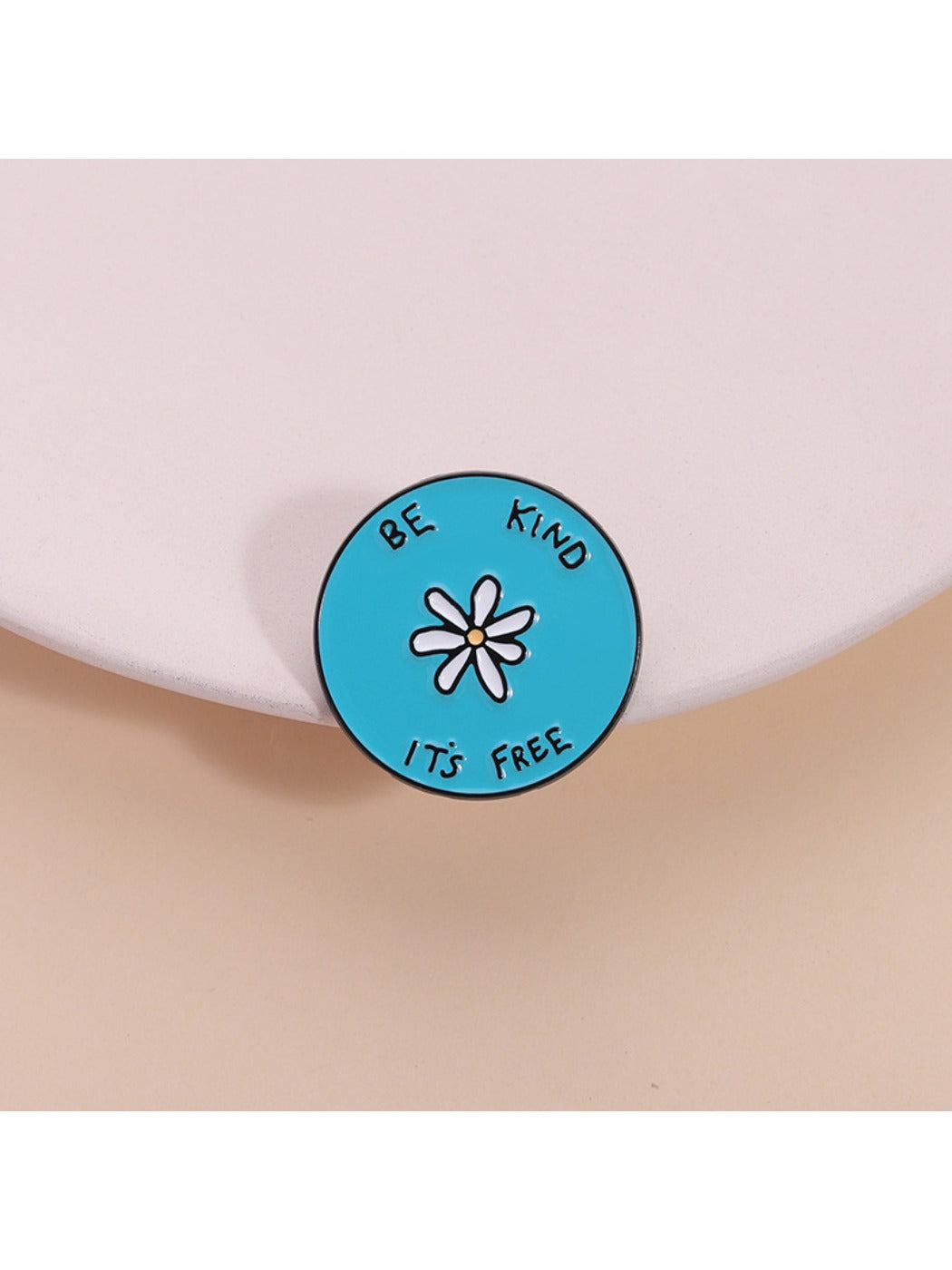 Pinori white flower alphabet blue round brooch on white background