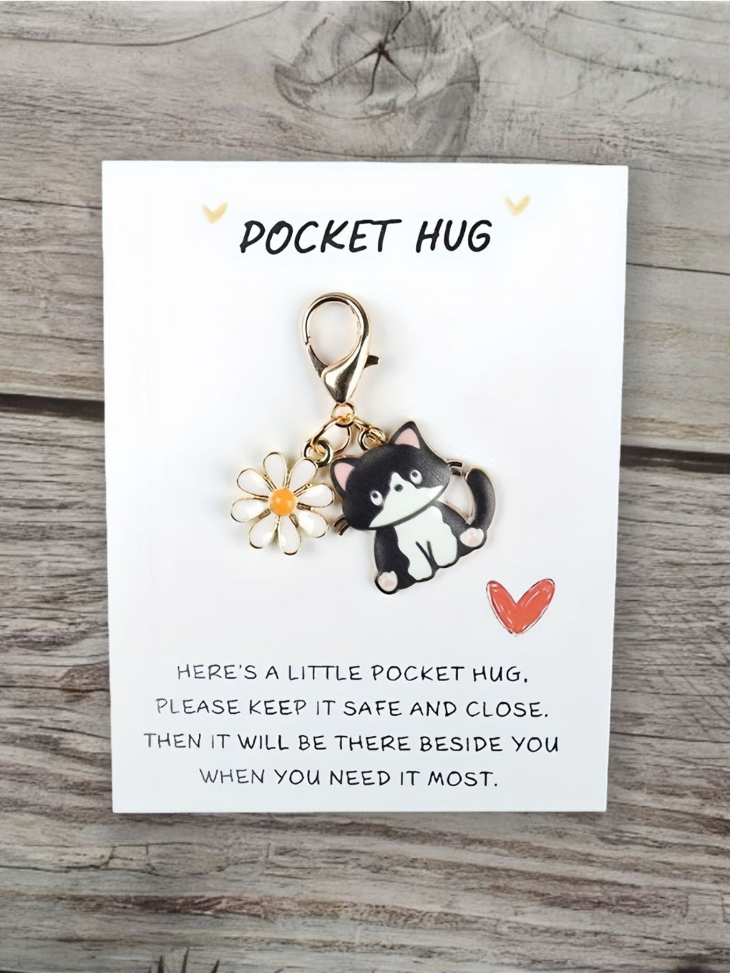 Taphug Pocket Hug keychain with cartoon cat charm hanging from a keyring