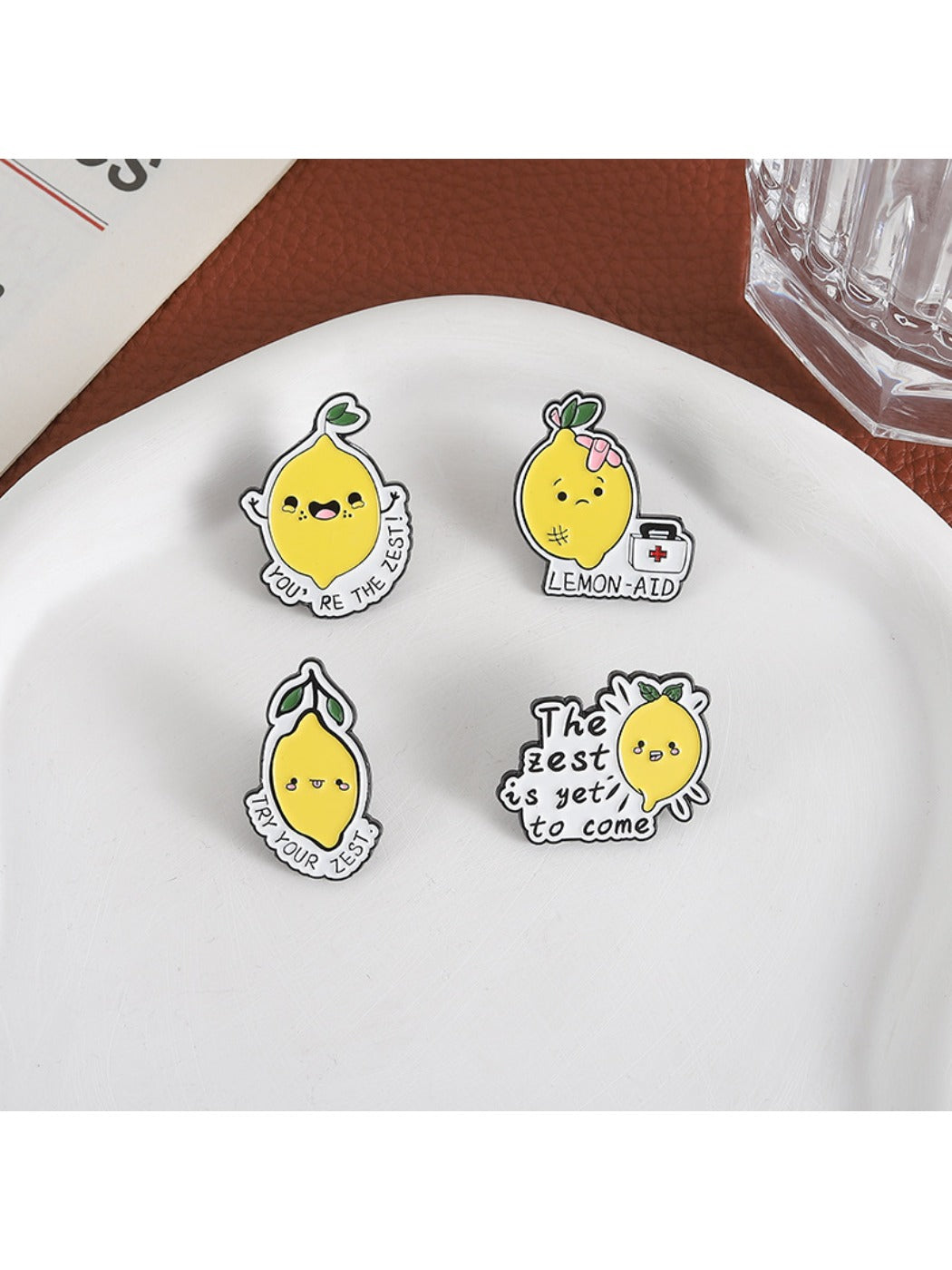 Close-up of Pinori lemon brooch showing detailed enamel and alloy design