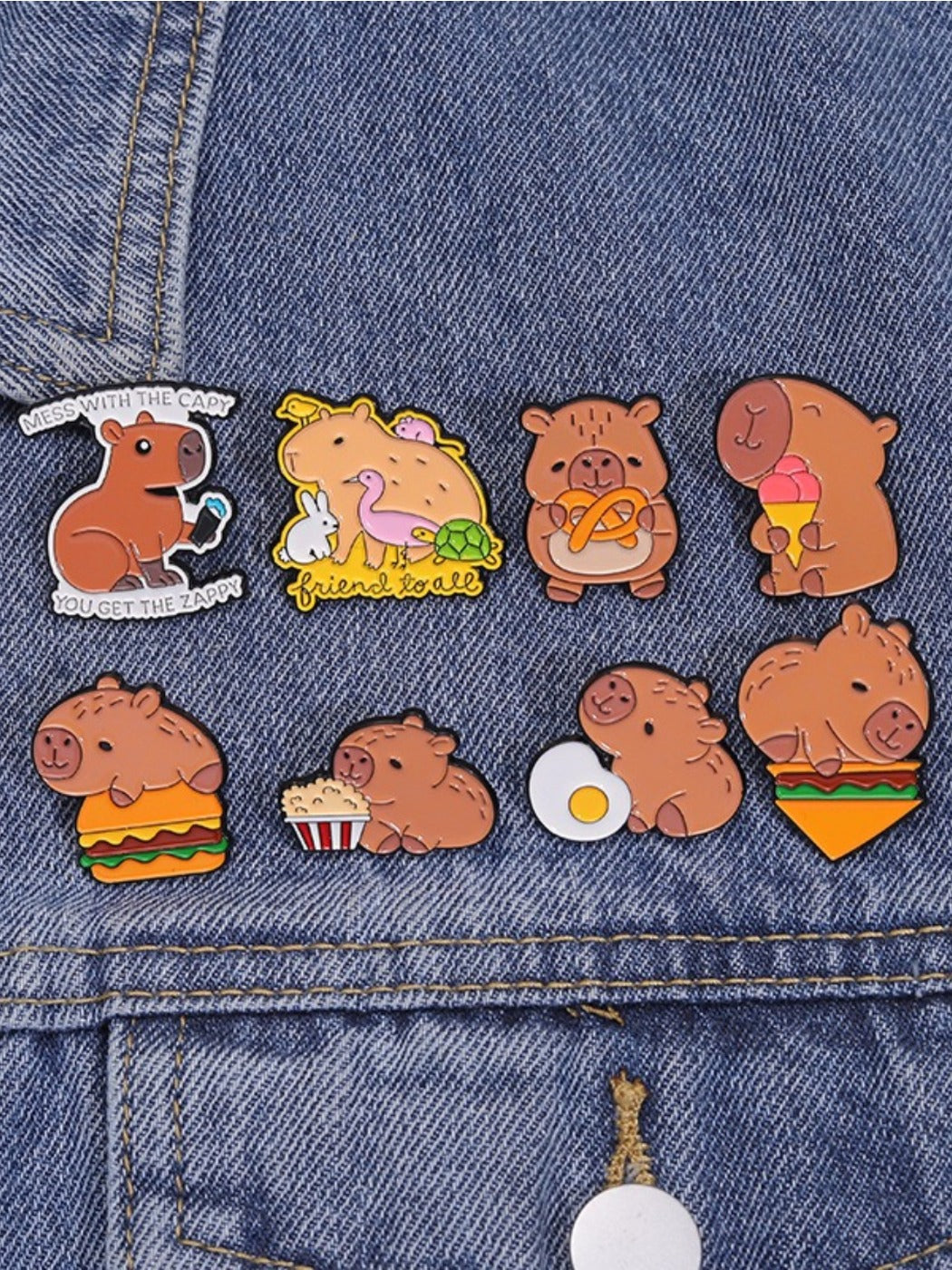 Back view of Pinori metal pin with capybara and hamburger design