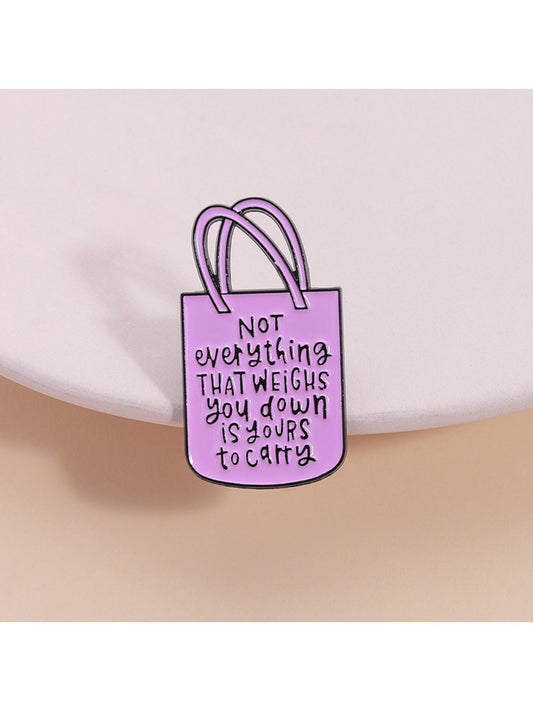 Pinori pink tote bag shaped brooch with gold-tone chain detail on white background