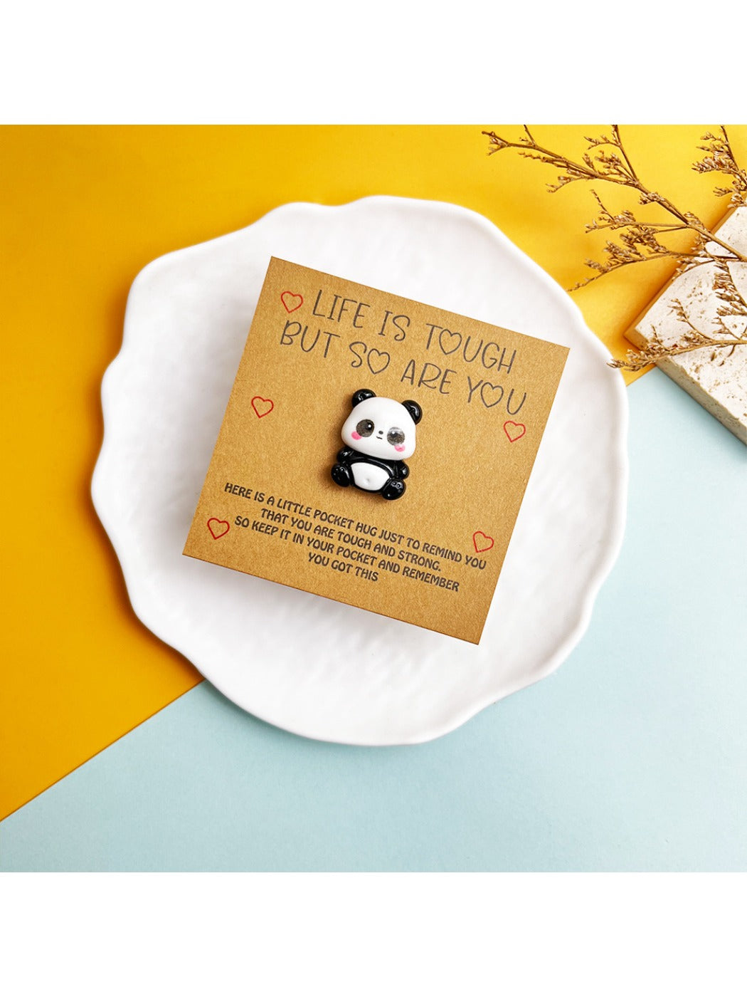 Hand holding the Taphug DIY cute panda pocket hug card