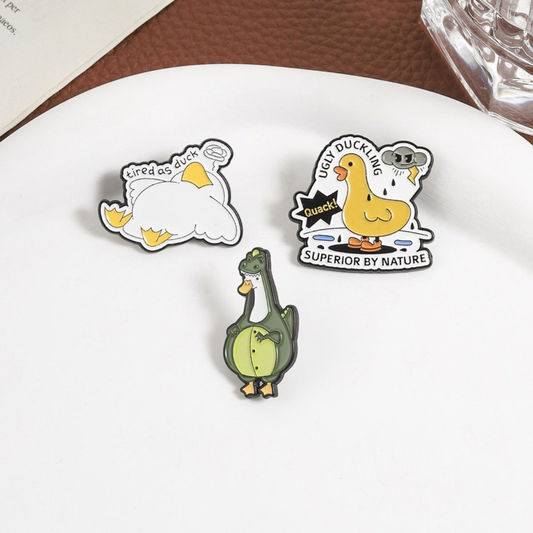 Close-up of Pinori enamel pin showing detailed playful character with vibrant colors