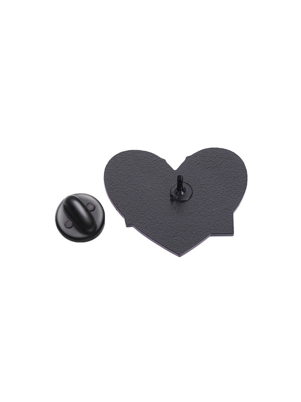 Pink heart alphabet pin placed next to matching punk style accessories