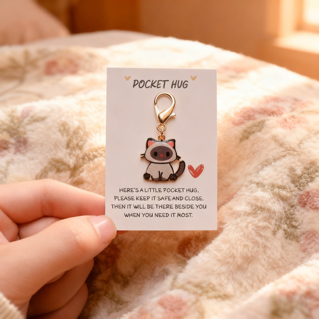 Back view of Taphug Kitten Charm Pocket Hug showing fabric and tag