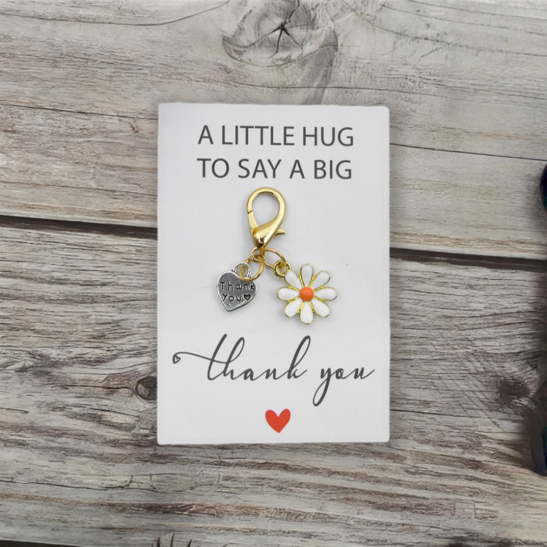 Taphug Thank You Daisy Pocket Hug card displayed with envelope on wooden surface