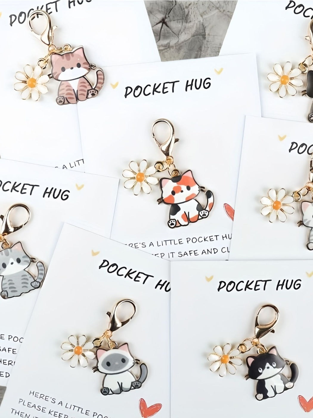 Taphug Pocket Hug keychain featuring a lovely cartoon cat charm on a white background