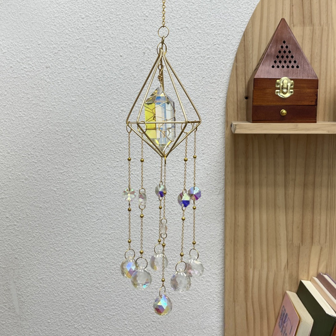 Side view of Somnira geometric prism suncatcher highlighting its three-dimensional shape