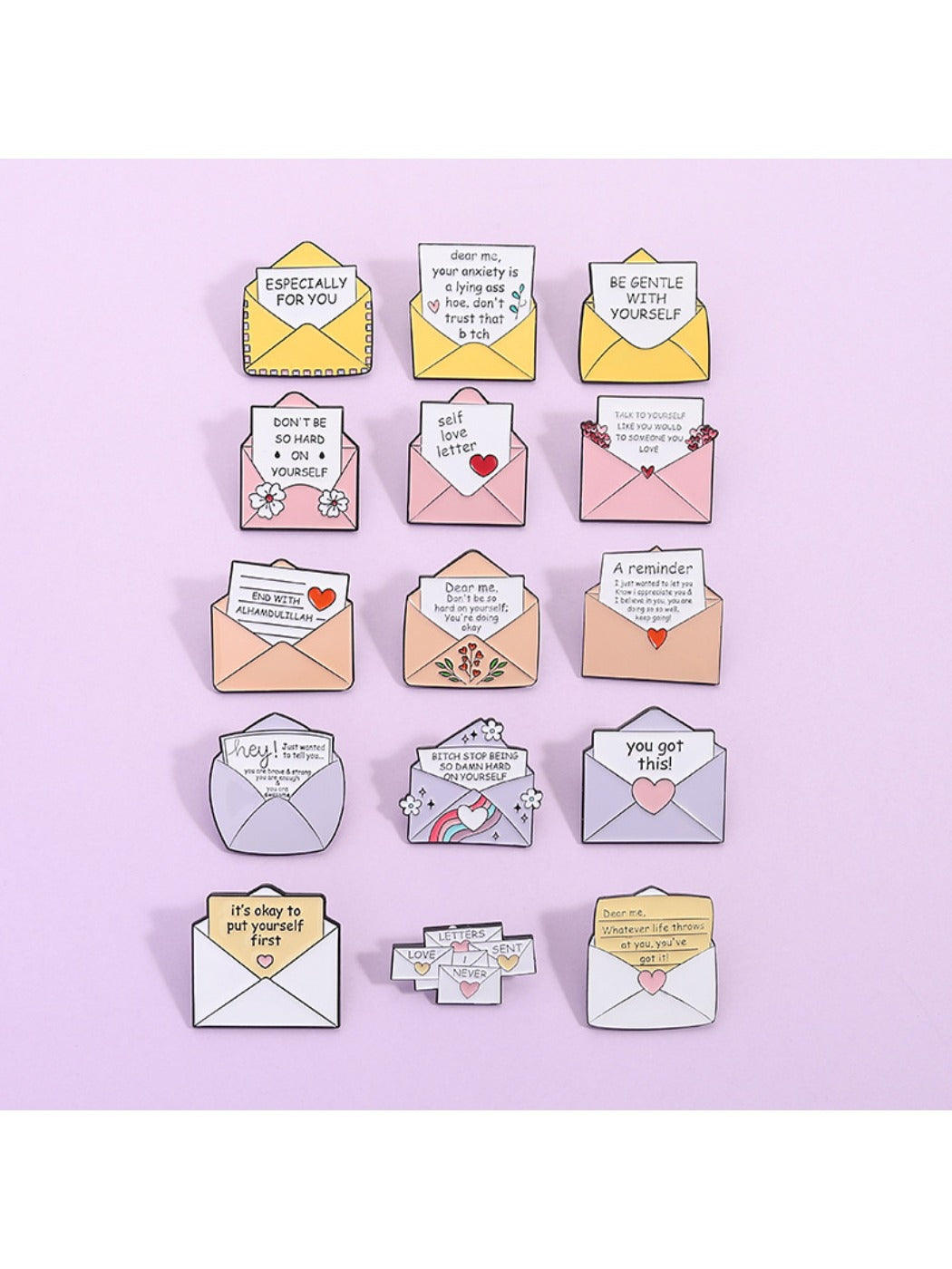 Pinori letter envelope brooch displayed on fabric surface