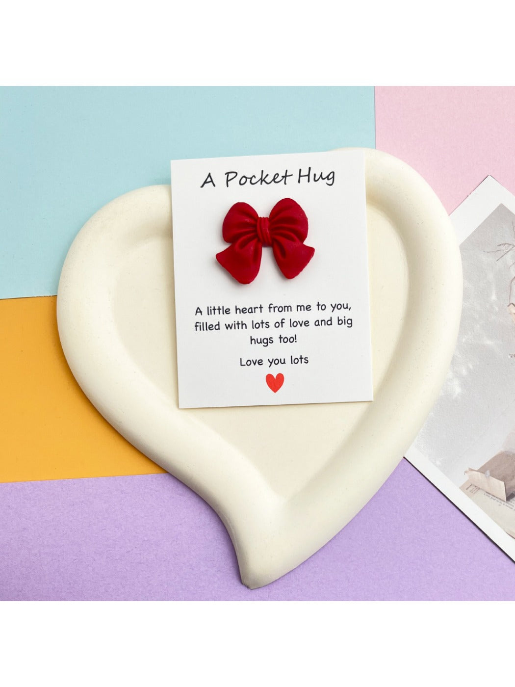 Taphug Pocket Hug greeting card with bow displayed on white background