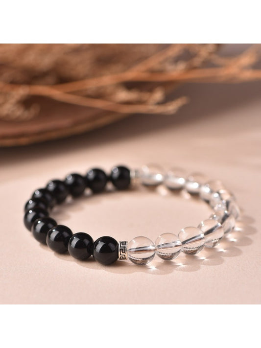 Emora women's bracelet with alternating white and black beads for good luck