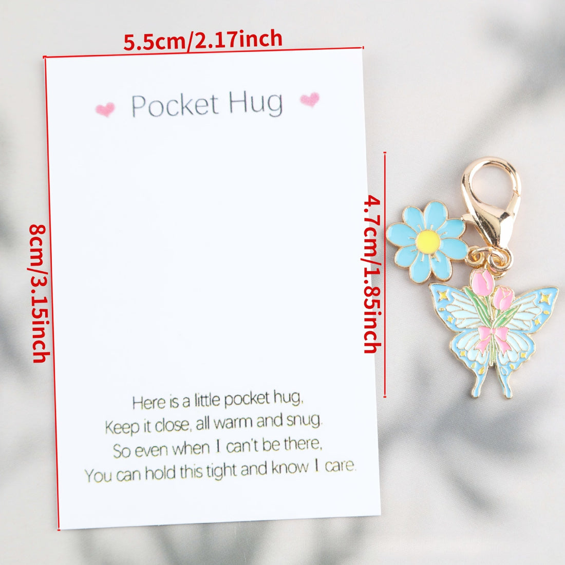 Taphug Pocket Hug showing the butterfly charm attached to a delicate chain