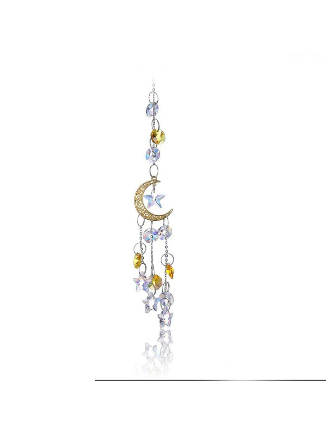 Dream catcher with golden moon frame and white feathers hanging in natural light