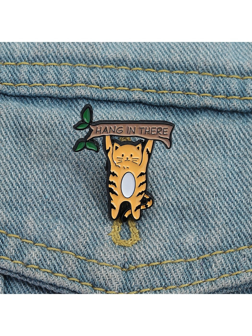 Back view of Pinori cat brooch displaying metal pin fastener and clasp
