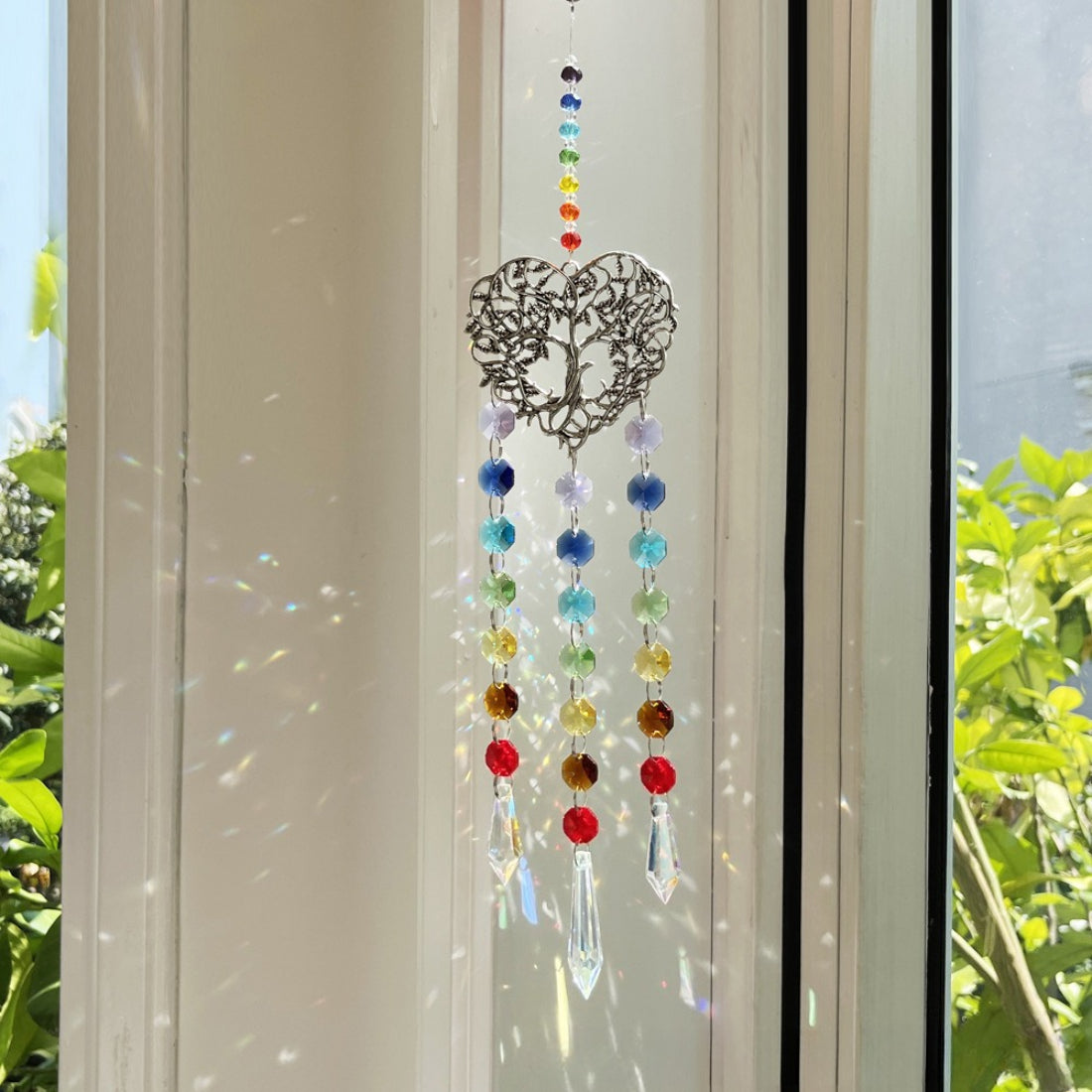 Side view of Somnira Heart Tree suncatcher highlighting the heart-shaped design and bead colors